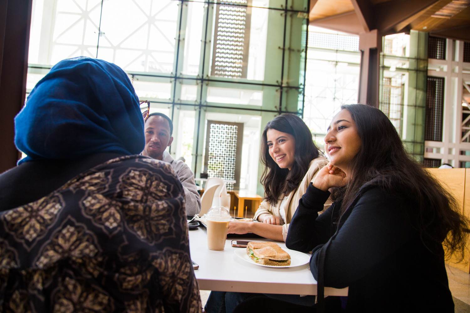 Students share a meal at HBKU Student Center on the Education City campus.