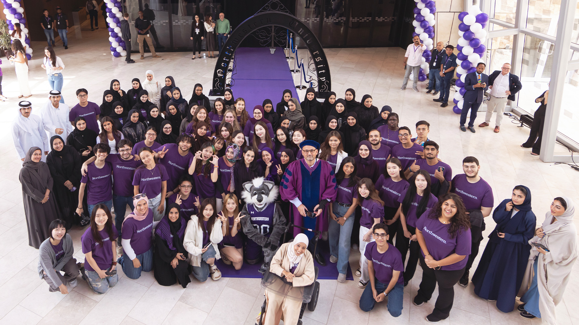 NU-Q welcomes its new students with the traditional march through the Weber Arch