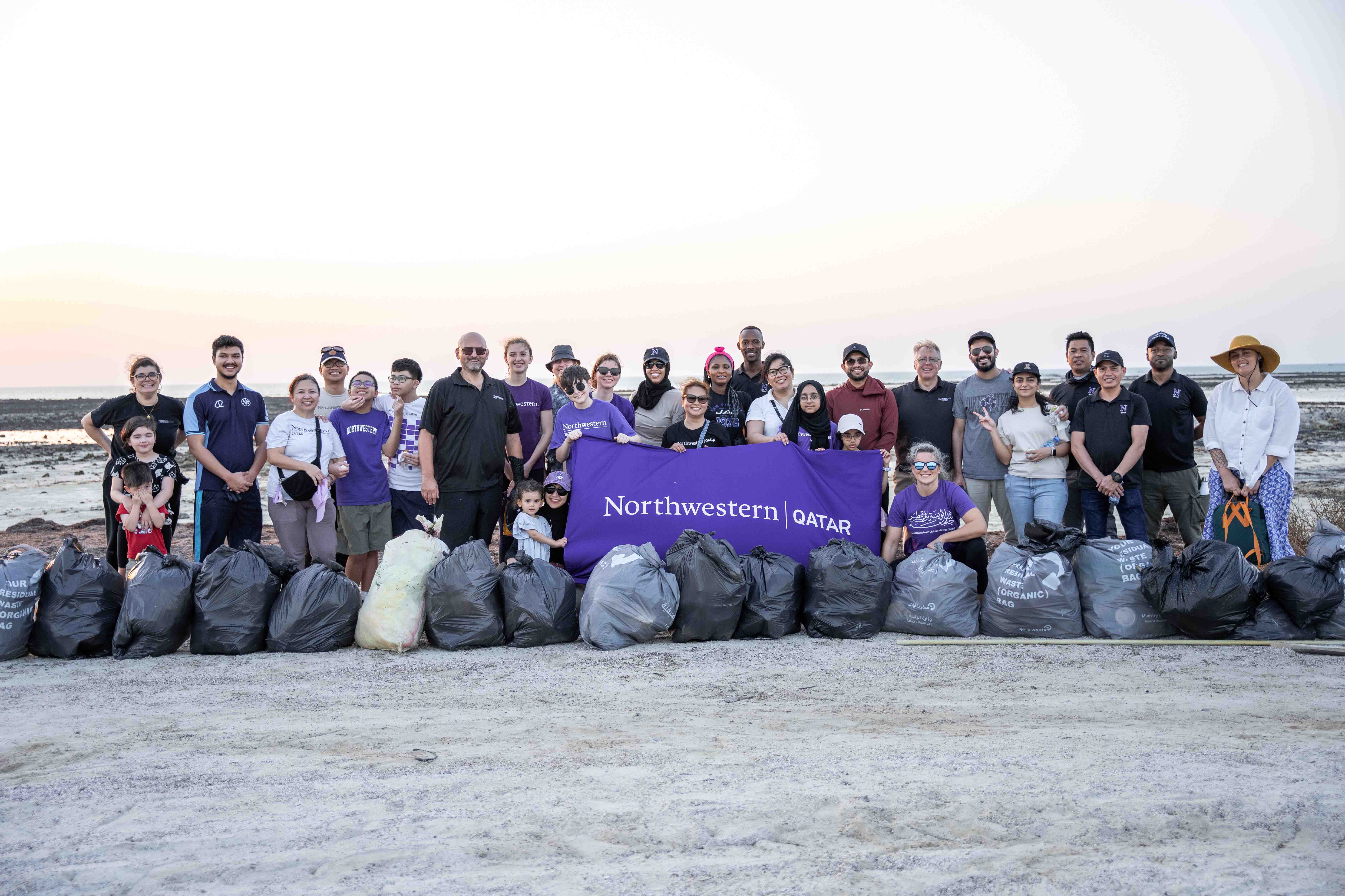 Faculty, staff, and students join forces during a beach cleanup along Qatar’s coast, embodying Northwestern Qatar’s commitment to environmental preservation and community well-being.