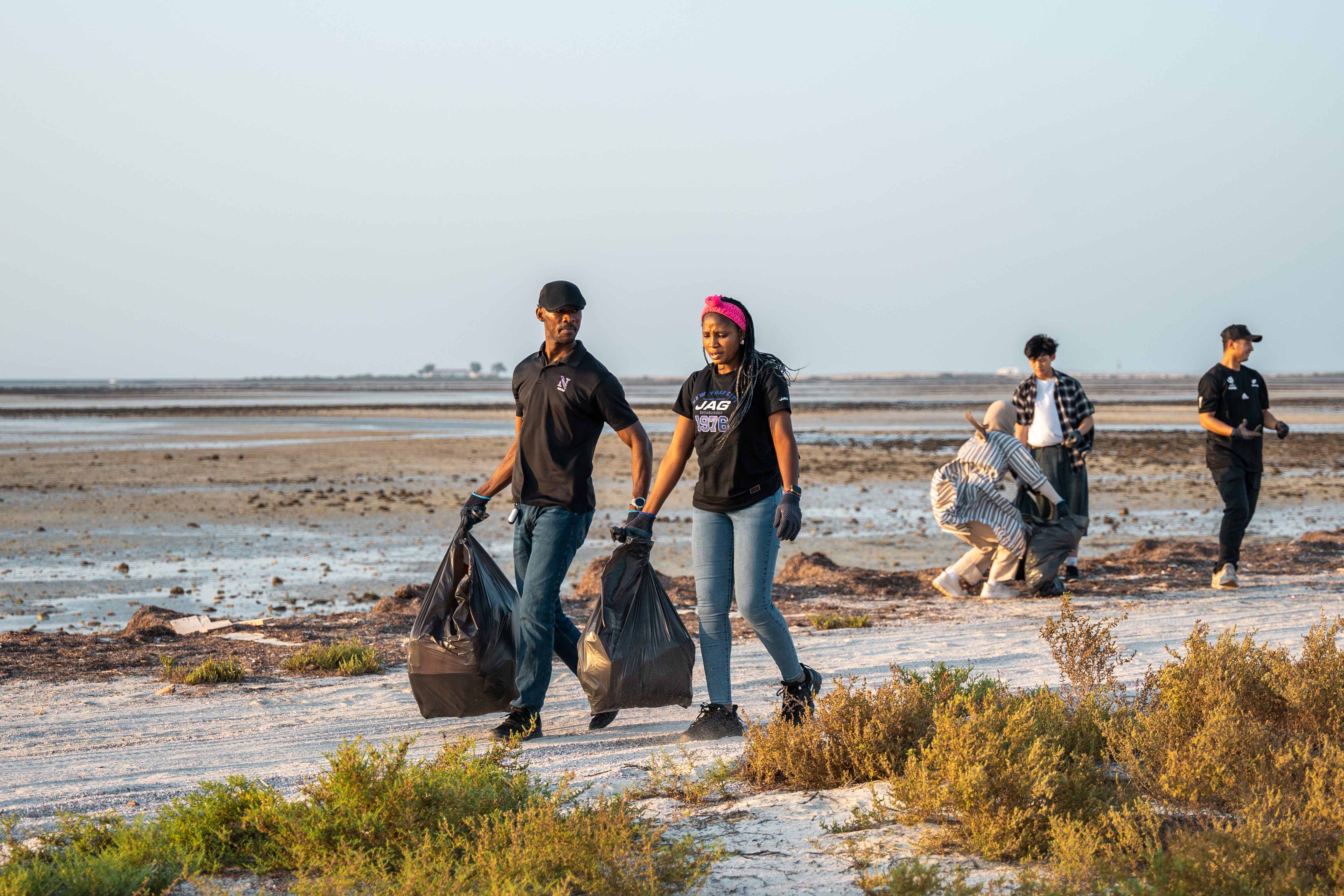 Participants collect plastic waste and debris, actively reducing pollution and protecting local coastal habitats as part of Northwestern Qatar’s dedication to responsible stewardship